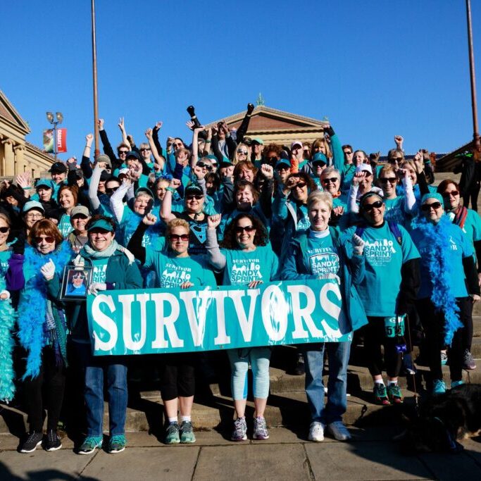 Survivors celebrate in front of the Art Museum after the Sandy Sprint.